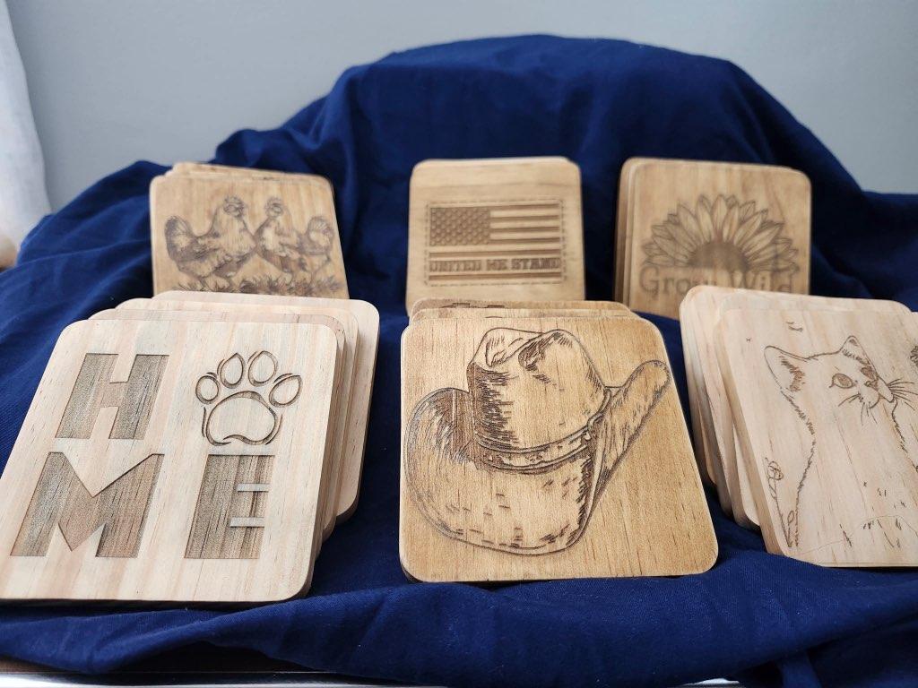 Set of 4 Wooden coasters with engraved designs
